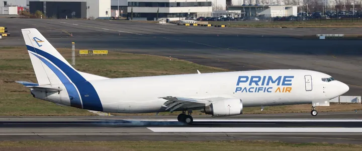 Stock photo of a Boeing 737-400 freighter with our logo added, not our plane